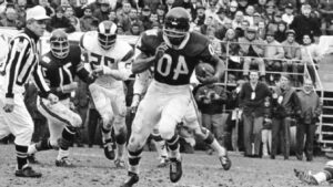 Gale Sayers was equally electrifying on offense as he was on special teams. AP Photo